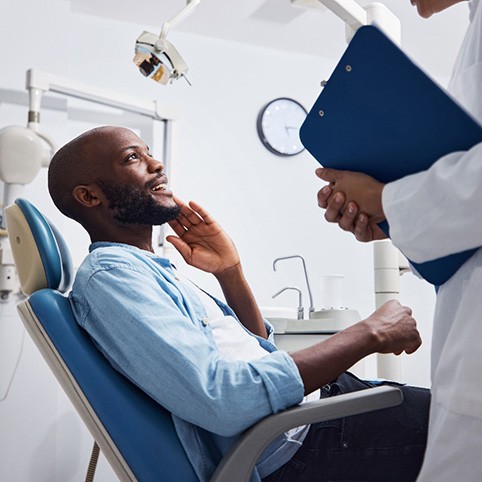 Patient feeling relief after a tooth extraction 